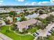 Wonderful aerial view of the condo community with pool, pond, and parking at 10263 Gandy N Blvd # 105, St Petersburg, FL 33702