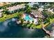 Stunning aerial view featuring pool, a jacuzzi and picturesque lakefront buildings and landscaping at 10263 Gandy N Blvd # 105, St Petersburg, FL 33702