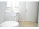Neutral bathroom with toilet, tile flooring, and white vanity with chrome faucet at 10263 Gandy N Blvd # 105, St Petersburg, FL 33702