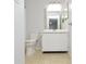 Bathroom featuring tiled floor, toilet, and vanity with a mirror at 10263 Gandy N Blvd # 105, St Petersburg, FL 33702