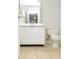 Modest bathroom featuring a white vanity and toilet paired with neutral tile flooring at 10263 Gandy N Blvd # 105, St Petersburg, FL 33702
