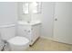 Bathroom featuring tiled floor, toilet, and vanity with a mirror at 10263 Gandy N Blvd # 105, St Petersburg, FL 33702