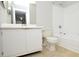 Bathroom features a single sink vanity with white cabinets, a toilet, and a shower-tub combo at 10263 Gandy N Blvd # 105, St Petersburg, FL 33702