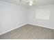 Cozy bedroom featuring vinyl flooring, a ceiling fan, and a window with blinds at 10263 Gandy N Blvd # 105, St Petersburg, FL 33702