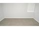 Neutral-toned bedroom with blinds on the window and light wood-look flooring at 10263 Gandy N Blvd # 105, St Petersburg, FL 33702