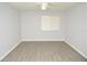 A bedroom with a ceiling fan and large window for ample natural light at 10263 Gandy N Blvd # 105, St Petersburg, FL 33702