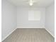 Spacious bedroom featuring vinyl flooring, a ceiling fan, and a window with blinds at 10263 Gandy N Blvd # 105, St Petersburg, FL 33702