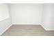 Bright bedroom with light gray walls and light wood-look flooring at 10263 Gandy N Blvd # 105, St Petersburg, FL 33702