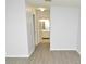 Bright room showcasing views from the bedroom into the bathroom and hallway at 10263 Gandy N Blvd # 105, St Petersburg, FL 33702
