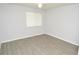 Bedroom with a ceiling fan and large window providing natural light at 10263 Gandy N Blvd # 105, St Petersburg, FL 33702