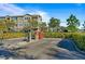 Exterior car wash station at condominium complex with buildings in the background and lush landscaping at 10263 Gandy N Blvd # 105, St Petersburg, FL 33702