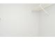 Walk-in closet with white wire shelving and light grey wood floors at 10263 Gandy N Blvd # 105, St Petersburg, FL 33702