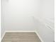 Walk-in closet with white shelf and light-toned wood-look flooring at 10263 Gandy N Blvd # 105, St Petersburg, FL 33702