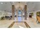 Spacious foyer features marble floors, high ceilings, marble pillars, and a decorative chandelier at 10263 Gandy N Blvd # 105, St Petersburg, FL 33702