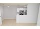 Spacious kitchen with appliances, white cabinets, and stylish tile flooring at 10263 Gandy N Blvd # 105, St Petersburg, FL 33702