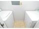 Functional laundry area with a side-by-side washer and dryer setup at 10263 Gandy N Blvd # 105, St Petersburg, FL 33702