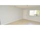 Bright room with tile flooring and natural light from the window at 10263 Gandy N Blvd # 105, St Petersburg, FL 33702