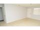 Bright living room with tile flooring, neutral gray walls, and a large window at 10263 Gandy N Blvd # 105, St Petersburg, FL 33702