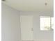 Bright living room featuring a front door and a window letting in lots of natural light at 10263 Gandy N Blvd # 105, St Petersburg, FL 33702