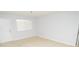 Bright living room with an entry door, window, and spacious layout at 10263 Gandy N Blvd # 105, St Petersburg, FL 33702