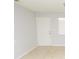 Bright living room with neutral walls, front door and neutral tile flooring at 10263 Gandy N Blvd # 105, St Petersburg, FL 33702