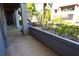 Exterior patio area with shrubbery and views of trees and nearby buildings at 10263 Gandy N Blvd # 105, St Petersburg, FL 33702