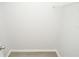 Spacious walk-in closet featuring wood laminate flooring, white walls, and a wire rack shelf at 10263 Gandy N Blvd # 105, St Petersburg, FL 33702