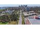 Aerial view featuring condos, city skyline, and lush green landscaping at 1036 N Shore Ne Dr # 5, St Petersburg, FL 33701