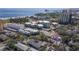 Stunning aerial view of a coastal property with multiple buildings, and ocean views at 1036 N Shore Ne Dr # 5, St Petersburg, FL 33701