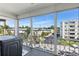 Balcony with screened windows that offer views of the building and parking at 1036 N Shore Ne Dr # 5, St Petersburg, FL 33701