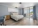 Bright bedroom with natural light, features a private balcony and stylish furniture at 1036 N Shore Ne Dr # 5, St Petersburg, FL 33701