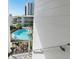 Elevated view of sparkling swimming pool surrounded by meticulously maintained landscaping at 1036 N Shore Ne Dr # 5, St Petersburg, FL 33701