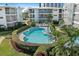 A refreshing swimming pool surrounded by lush greenery and lounge chairs at 1036 N Shore Ne Dr # 5, St Petersburg, FL 33701