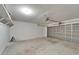 Uncluttered two-car garage with a light gray door and automatic opener at 10403 Frog Pond Dr, Riverview, FL 33569