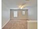 Neutral open loft space with carpeted floors and natural light at 10403 Frog Pond Dr, Riverview, FL 33569