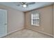 Bedroom showcasing plush carpet and a ceiling fan, creating a relaxing atmosphere at 10621 Shady Falls Ct, Riverview, FL 33578