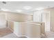 Bright hallway with neutral paint and plush carpeting at 10904 Summerton Dr, Riverview, FL 33579