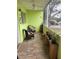 Cozy screened-in patio area featuring comfortable seating and potted plants, perfect for relaxing outdoors at 11100 86Th Ave # 203, Seminole, FL 33772
