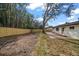 Spacious fenced backyard with a brick patio, ideal for outdoor entertaining and relaxation at 1125 Fairwood Ave, Clearwater, FL 33759