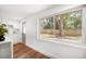 Bright kitchen features white cabinets and an exterior view at 1125 Fairwood Ave, Clearwater, FL 33759