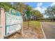Cliff Stephens Park entrance with signage showing trail maps and biking/walking path details at 1125 Fairwood Ave, Clearwater, FL 33759
