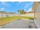 Spacious backyard with a well-maintained lawn and a white fence for privacy at 1140 7Th Ne Ave, Largo, FL 33770