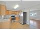 Updated kitchen features modern appliances, ample cabinet space, and an open layout at 1140 7Th Ne Ave, Largo, FL 33770
