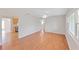 Bright living room features gleaming hardwood floors and large windows at 1140 7Th Ne Ave, Largo, FL 33770