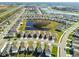 Wide aerial view showcases a community surrounded by tranquil ponds and lush landscaping at 16126 Sunday Stroll Way, Odessa, FL 33556