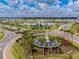 Aerial view of The Preserve community featuring a fountain, clubhouse, and manicured landscaping at 16126 Sunday Stroll Way, Odessa, FL 33556