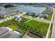 Aerial view of community green space and lake with walking path at 16126 Sunday Stroll Way, Odessa, FL 33556