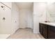 Bathroom featuring a shower/tub combo with white tile and a dual sink vanity at 16126 Sunday Stroll Way, Odessa, FL 33556