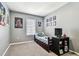 Comfortable bedroom with window, cozy bed, and themed posters, perfect for relaxation at 16126 Sunday Stroll Way, Odessa, FL 33556