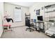 Bright bedroom featuring a window, computer setup, and shelving for organized storage at 16126 Sunday Stroll Way, Odessa, FL 33556